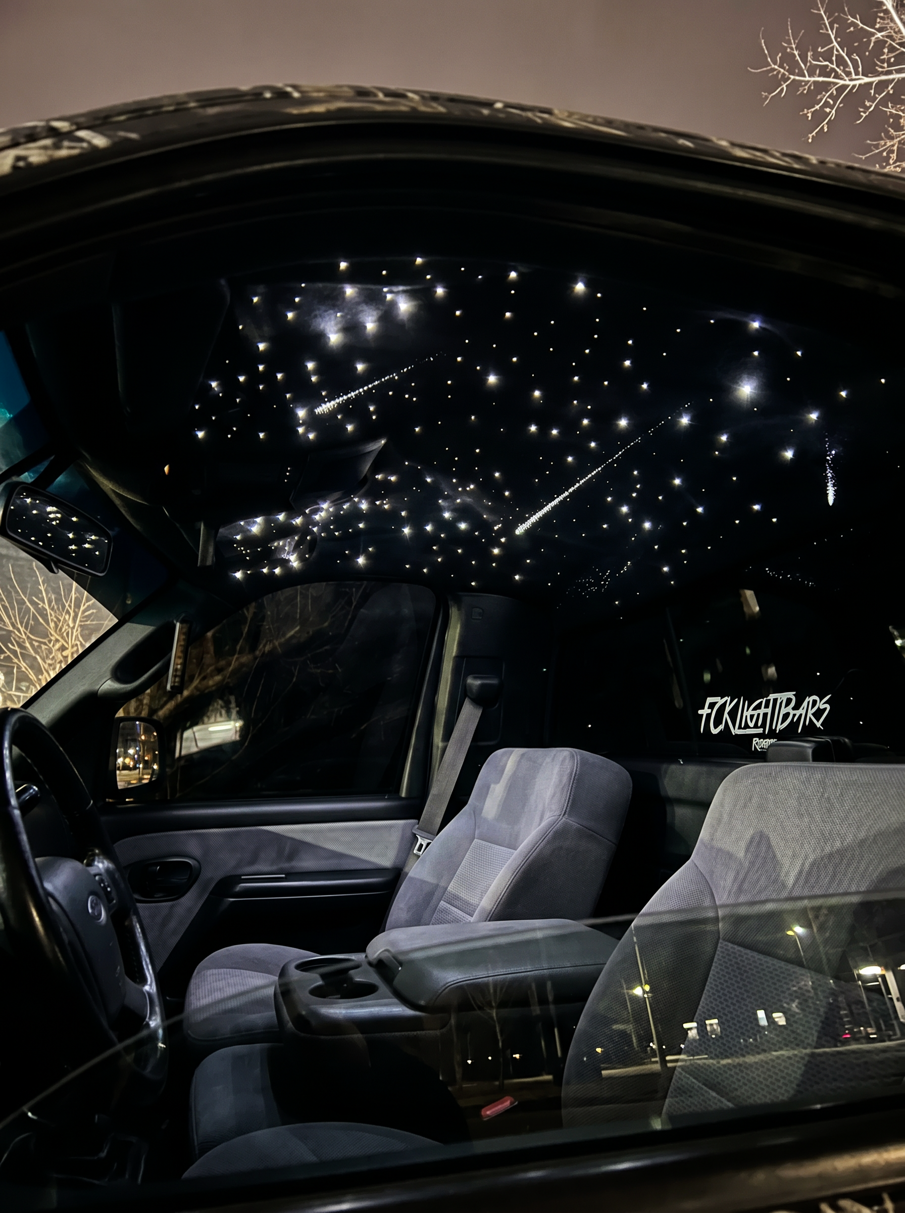 Shooting Star Headliner Kit installed in truck cab — meteors streaking across fiber optic star ceiling